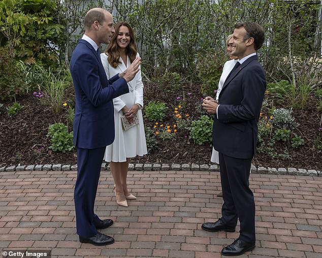 Prince William and Kate chat with French President Emmanuel Macron and his wife Brigitte Macron at a reception for G7 leaders at The Eden Project during the summit on June 11, 2021