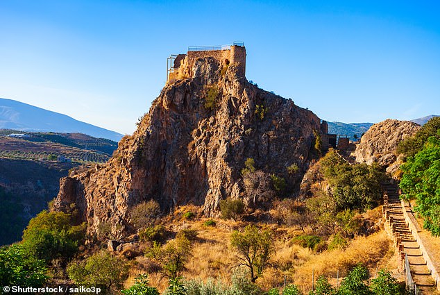 While it might look like a quaint and picturesque area, the town has one bizarre characteristic - dying there on weekends is 'banned'. Pictured: Lanjaron Castle