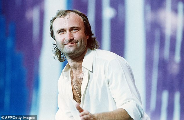 Phil Collins performing during the First Live Aid concert at the JFK stadium in Philadelphia, after crossing the Atlantic following his set at Wembley