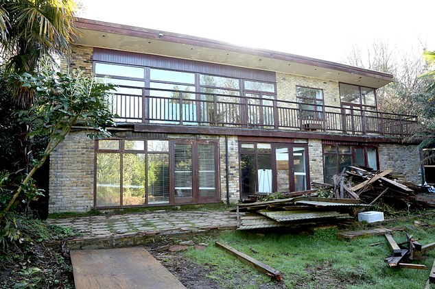 Cat and Patrick paid £4.9million for the rundown 1950's property (pictured) and made it their mission to create their 'forever home'