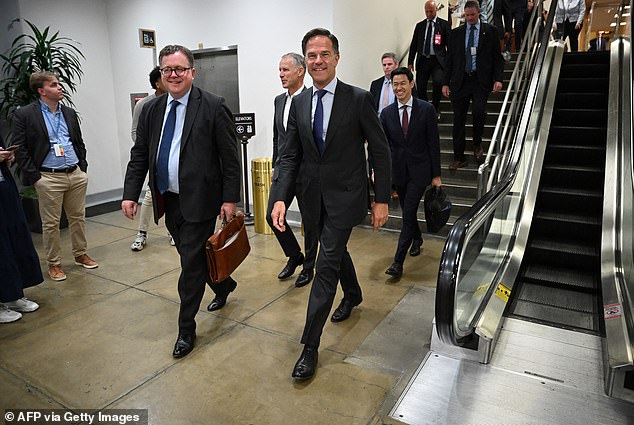 NATO Secretary General Mark Rutte (C) told the Daily Mail new U.S. arms packages for Ukraine financed by Europe will be 'potentially massive. And not only air defense, it is also missiles and ammunition'