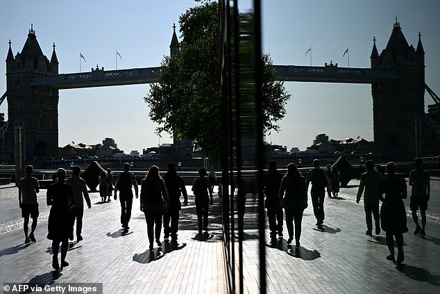The remote working boom is over, property experts have suggested, with prices rising in London commuter belt towns and falling further afield (pictured: commuters earlier this month)