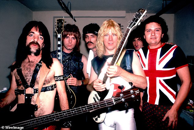 David Kaff, (end right) who played keyboardist Viv Savage in the iconic 1984 film, died peacefully in his sleep on July 11, per a statement from his band Mutual of Alameda’s Wild Kingdom