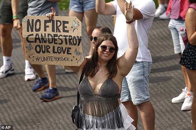 Organisers of the popular festival said that they worked tirelessly through the night to reach a solution, with the event successfully going ahead the next day due to other parts of the festival remaining unaffected. Pictured: a reveler at the first day of Tomorrowland festival on Friday, July 18