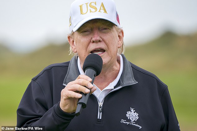 US President Donald Trump on the first tee of his new golf course in Scotland