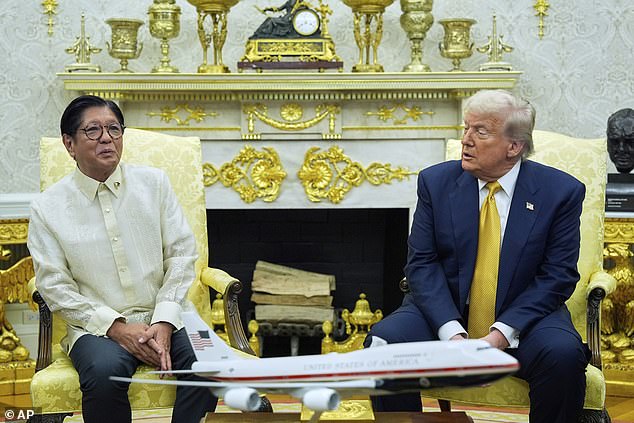 President Donald Trump meets with Philippine President Ferdinand Marcos Jr., in the Oval Office of the White House, Tuesday, July 22, 2025, in Washington. He accused Barack Obama of 'treason' during a question-and-answer session with reporters