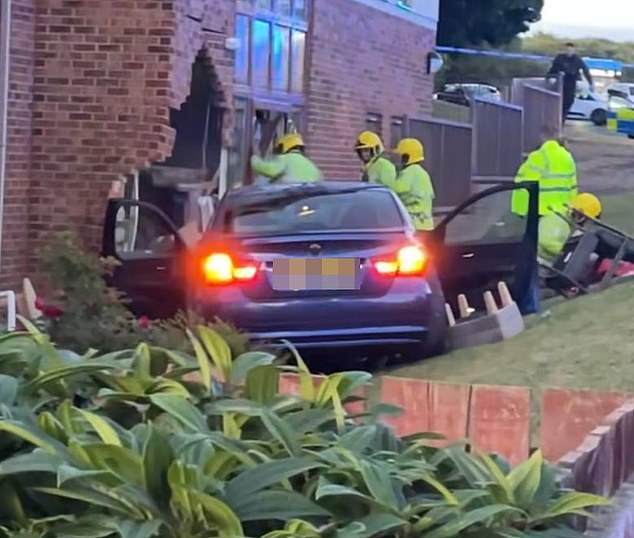Pictured is the BMW following the alleged crash at the care home earlier this week
