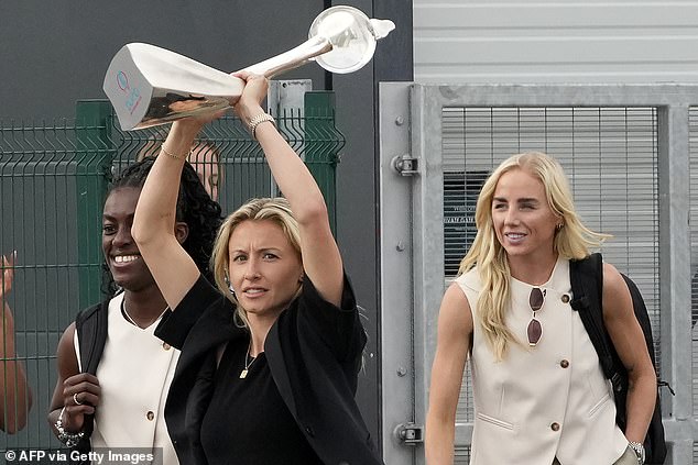 MPs have called for all the England players to be made dames. Pictured: England defender Leah Williamson (centre), striker Michelle Agyemang (left) and defender Alex Greenwood (right) leave Southend Airport.