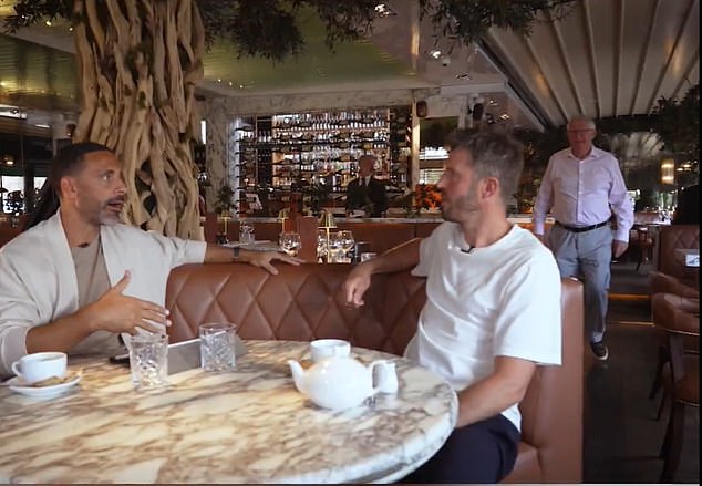 Sir Alex Ferguson was seen in the background as Rio Ferdinand spoke to Michael Carrick