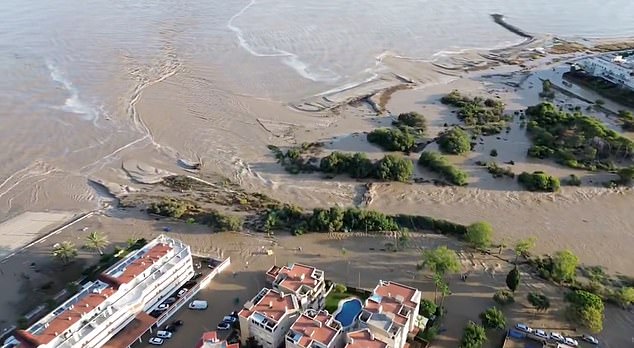 Holidaymakers in Spain are facing severe weather warnings after storms and torrential rainfall battered parts of the country - leaving streets flooded and cars submerged