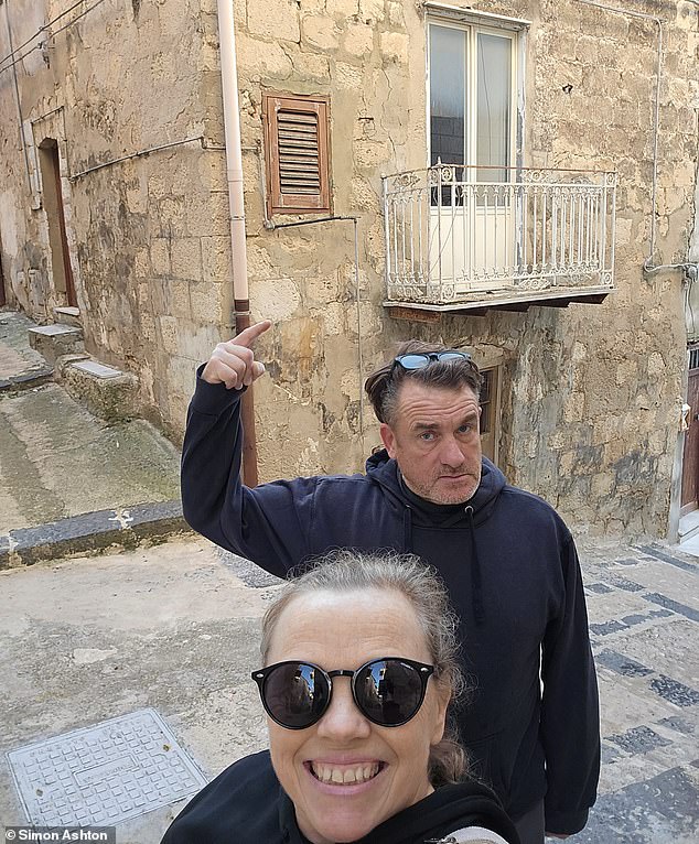 Derbyshire couple Sally Boole, 54, and her husband Martin, 56, outside the house in Mussomeli, Sicily, that they bought for only 1 euro