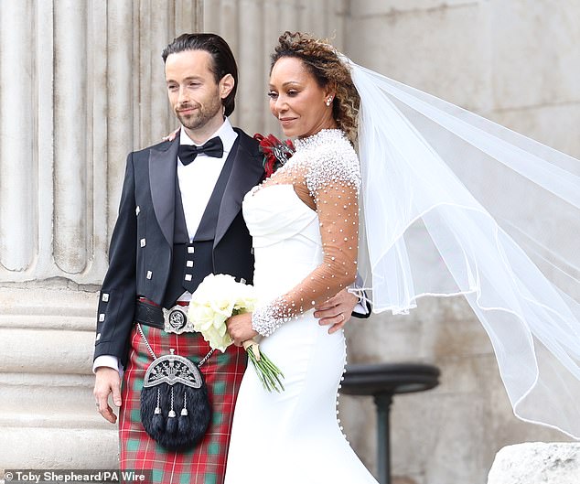 Geri Halliwell has so far failed to acknowledge her Spice Girl's bandmate Mel B 's star-studded wedding on Saturday (the couple are pictured)