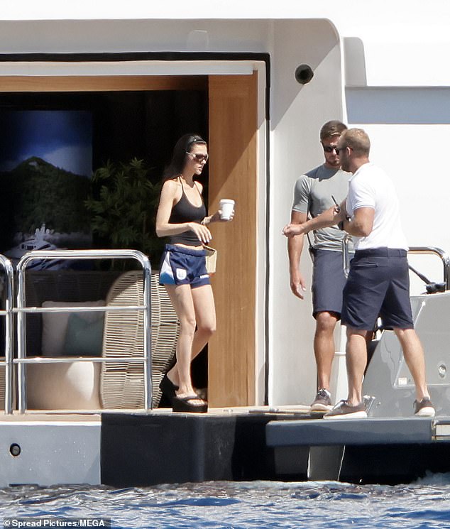 Nicola Peltz has made a subtle nod to father-in-law David Beckham as she sported a pair of his football shorts while out on her family's super yacht