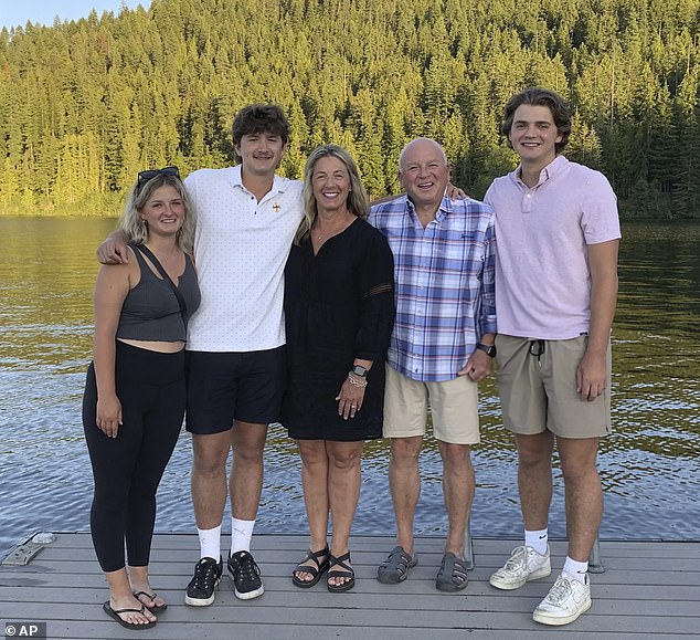Stacy Chapin and her husband Jim are seen with their triplets Maizie, left, Ethan, second from left, and Hunter, right, at Priest Lake, her late son's favorite place, during a family trip in July 2022