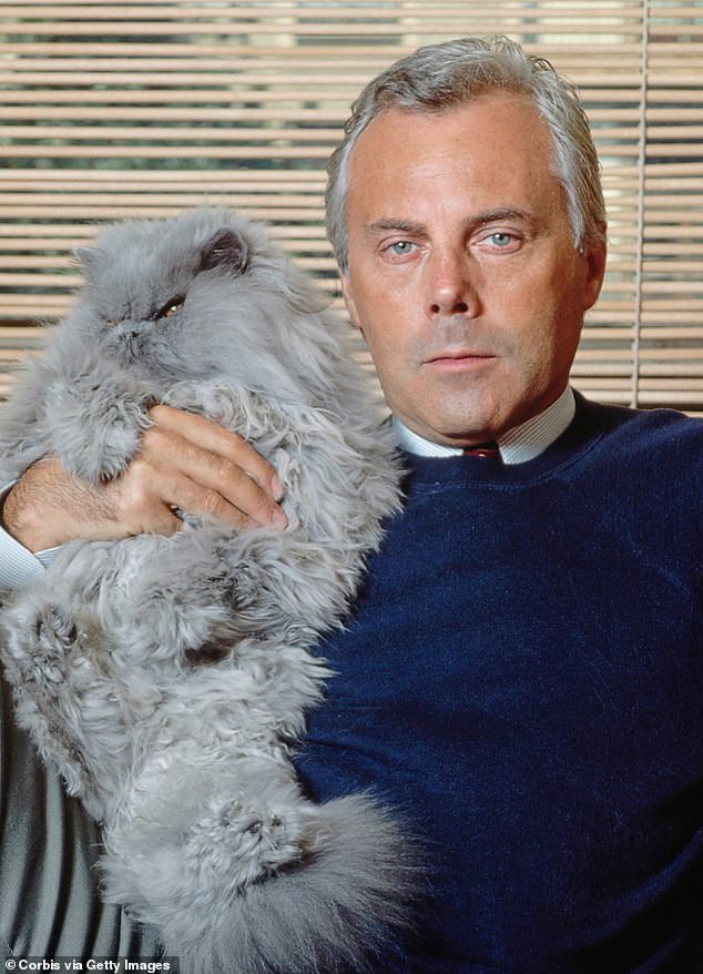 With one of his beloved cats in 1982