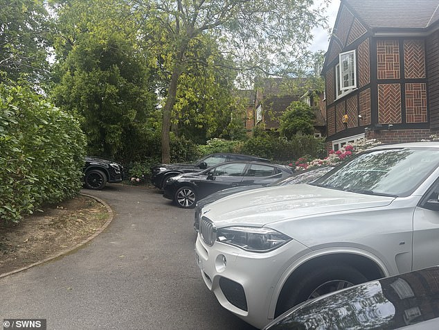 Several cars parked outside homes of residents who live near the Wimbledon Tennis Courts