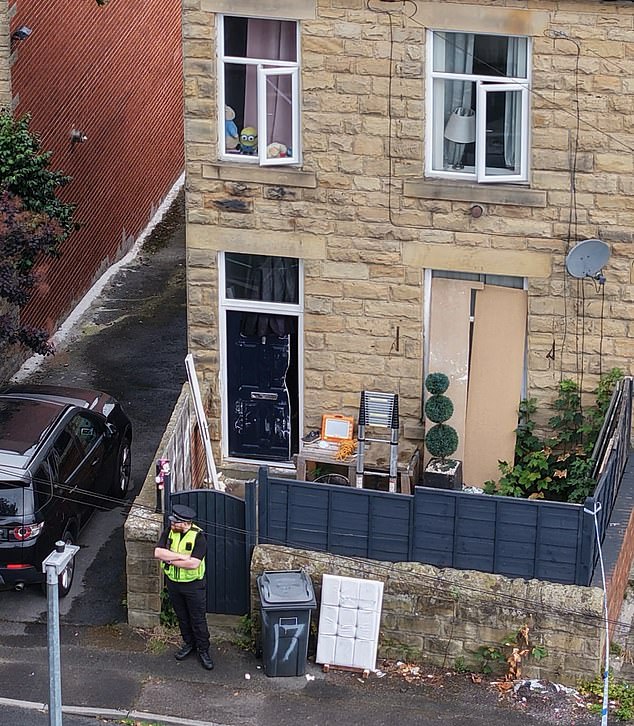 West Yorkshire Police said the suspect told them there was a dead woman, in her 20s, at a property in Batley which was later found in Norfolk Street