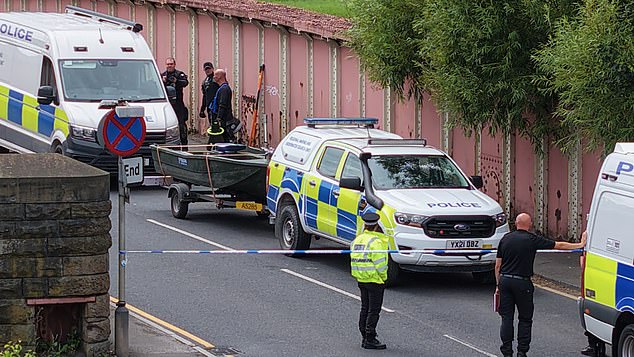 A murder probe has been launched as a woman's body was found after a supermarket robbery