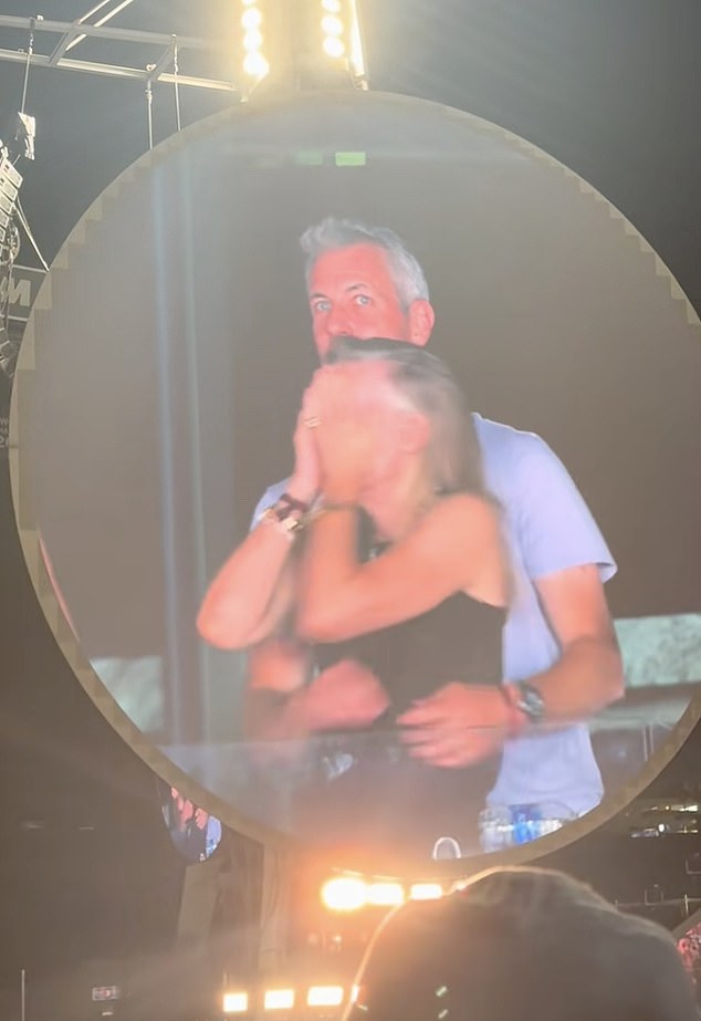 The couple were seen covering their faces, with Byron, the head of the AI startup Astronomer, diving out of view and Cabot turning away from the camera