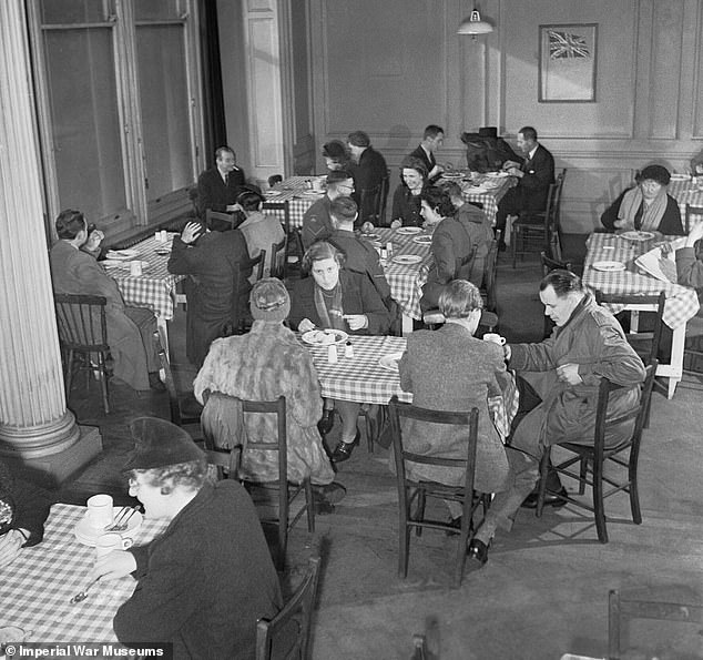 Members of the public enjoying a meal in one of the chain of British Restaurants established during the Second World War, London, 1943