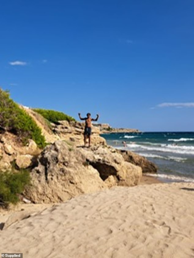Ricardo is seen here posing on a rock next to the beach. He was described by his aunt as the 'softest, sweetest, gentlest boy you could wish to meet'