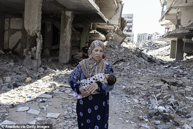 Seham Taafish is pictured with her 20-day-old baby in the Tel al-Hawa area of Gaza City. She is facing serious difficulties due to a lack of basic food supplies and baby formula