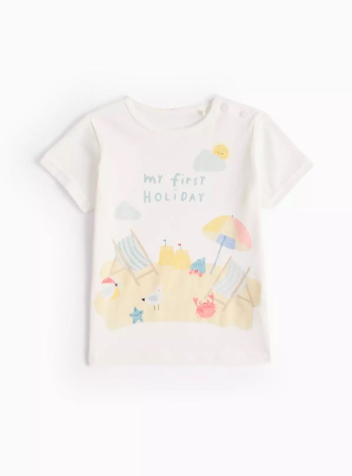 White children's t-shirt with beach scene and "My first holiday" text.