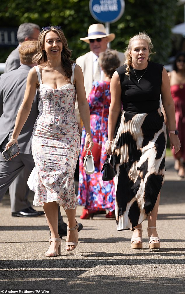 Some chose to wear bold patterns, including these revellers, who opted for a floral print coresetted dress and a leopard print midi dress