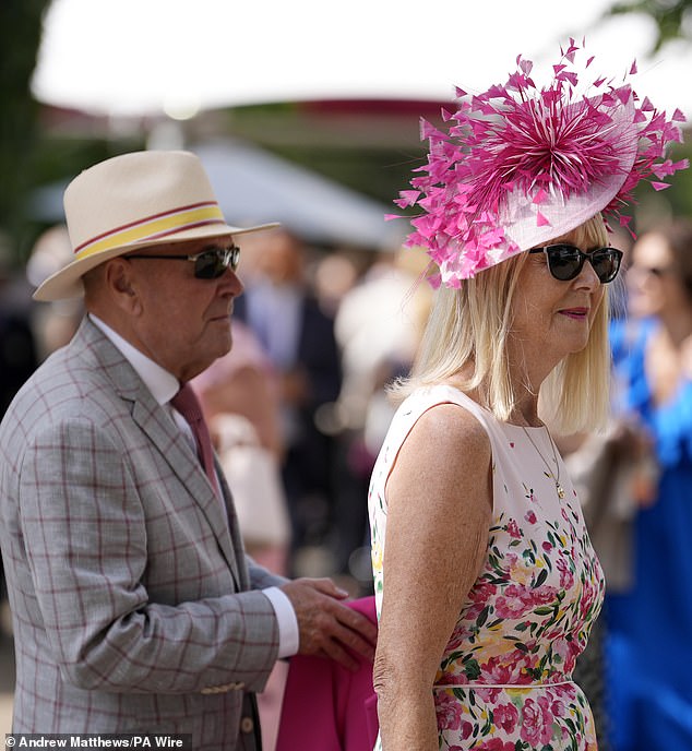 HAT'S THE ONE: For many, going to the races is all about the headwear, and this attendee donned a bold fuchsia fascinator
