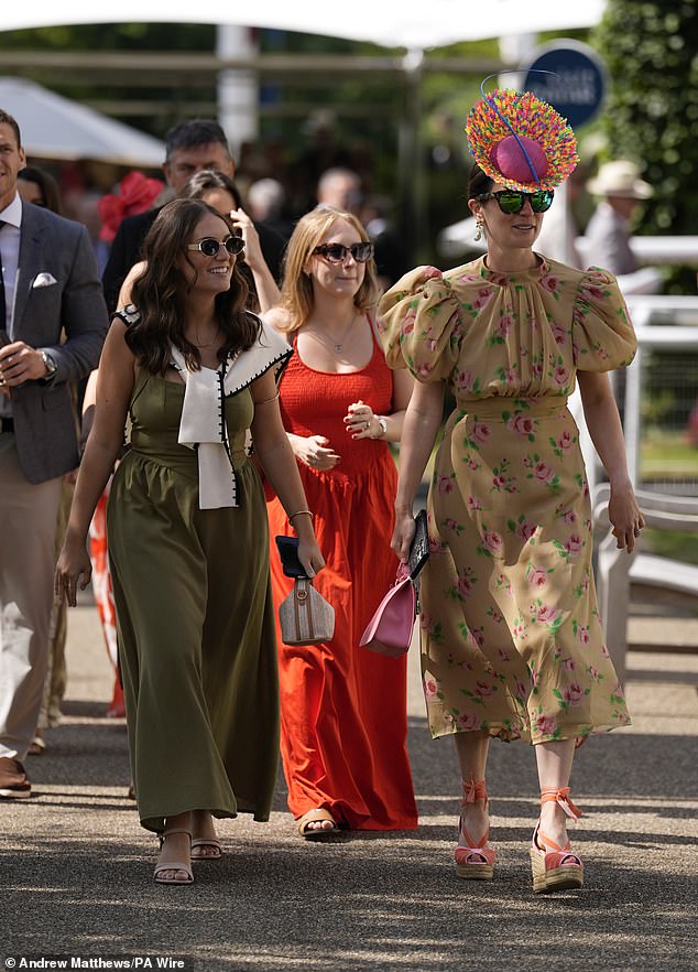 EYE CATCHING: With the weather back to being mild today, racegoers donned their finest frocks and hats
