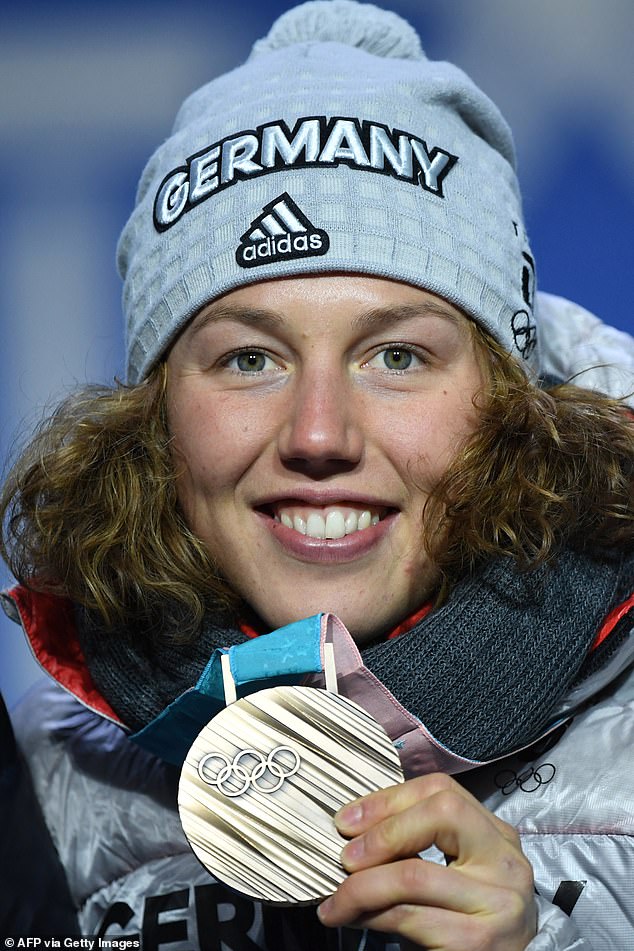 Laura Dahlmeier poses on the podium during the medal ceremony for the Biathlon Women's 15km Individual at the Pyeongchang Medals Plaza during the Pyeongchang 2018 Winter Olympic Games