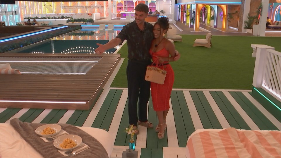 Shakia and Harry from Love Island stand by a pool and two plates of pasta.