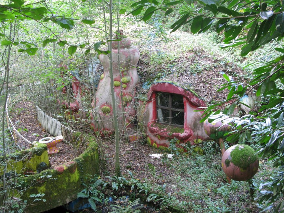 Overgrown remains of Mr. Blobby's house at a closed theme park.