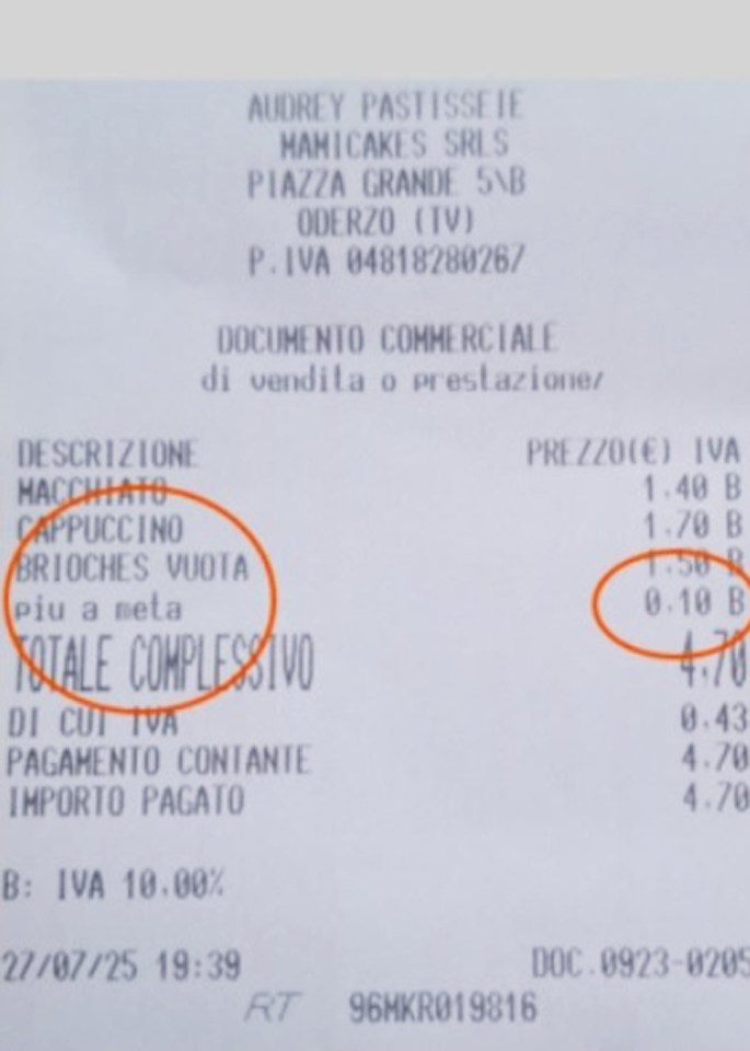 Bakery receipt showing a charge for cutting a croissant in half.