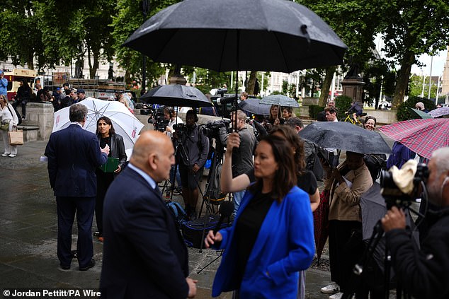 Members of the media report from outside the Supreme Court in London, where lenders have avoided potentially having to pay compensation to millions of drivers after the court ruled that they are not liable for hidden commission payments in car finance schemes