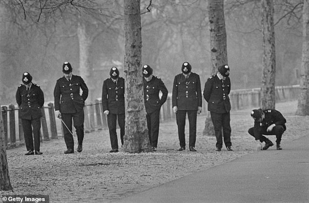 Ball also attempted to murder two policemen and shot a chauffeur, while trying to drag Princess Anne from her limousine (Pictured: Police searching for bullets after the incident)