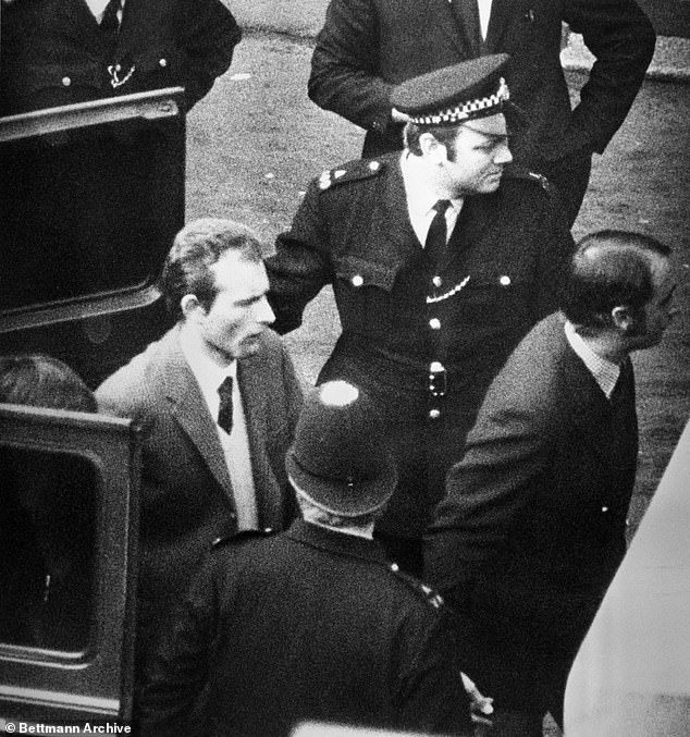 Bell being escorted by police to the Old Bailey. After entering guilty pleas, Bell's barrister John Hazan QC said he was 'mad'