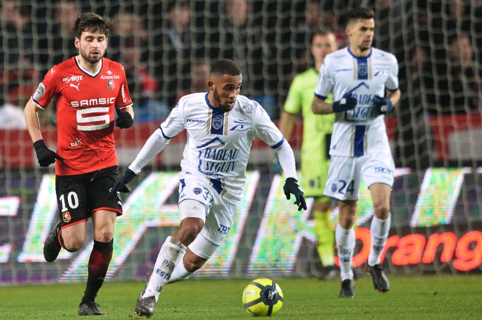 Soccer players vying for the ball during a match.