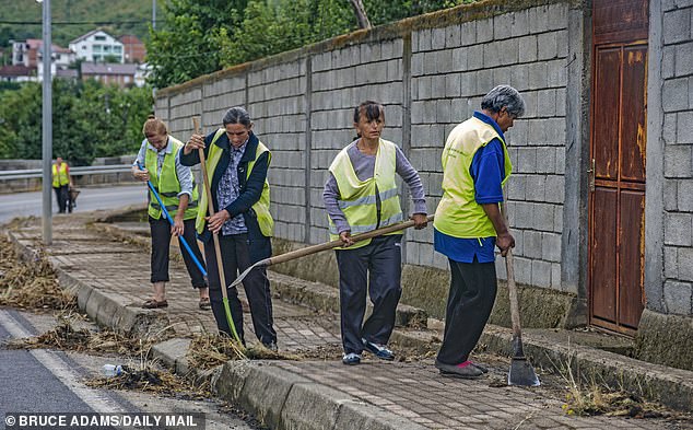 An all female team of council street cleaners in Has, Northern Albania