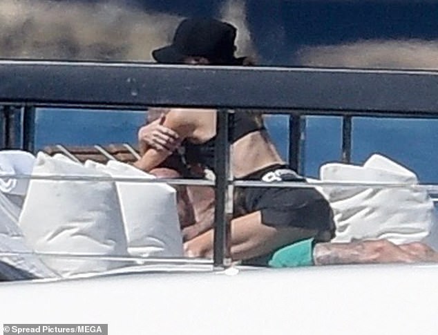 Posh and Becks' looked still so in love all these years later as she was seen straddling the shirtless hunk on top deck