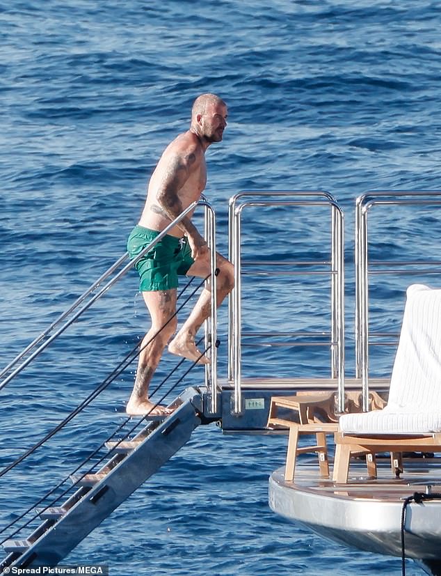 The shirtless hunk flashed his muscular physique