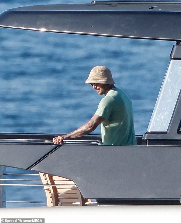 David ditched the shirtless look for a green T-shirt