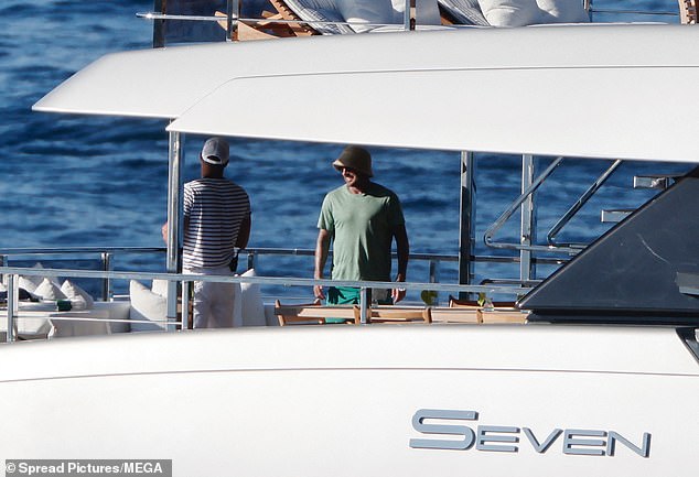 He was seen smiling and chatting to deckhands