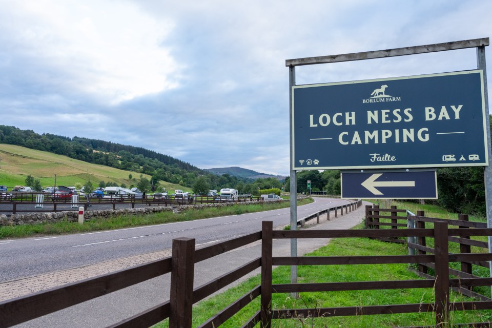 Loch Ness Bay Camping sign and campsite.