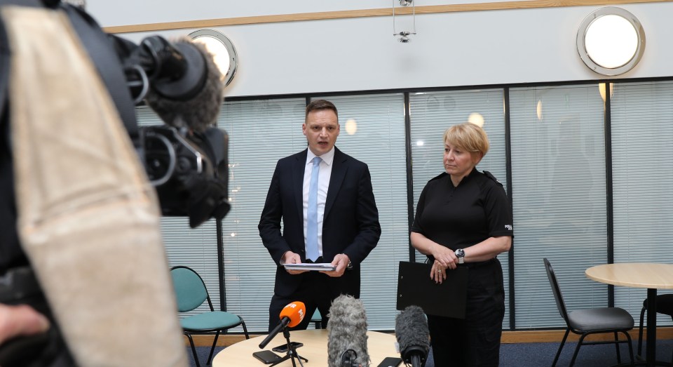 Police officers at a press conference.