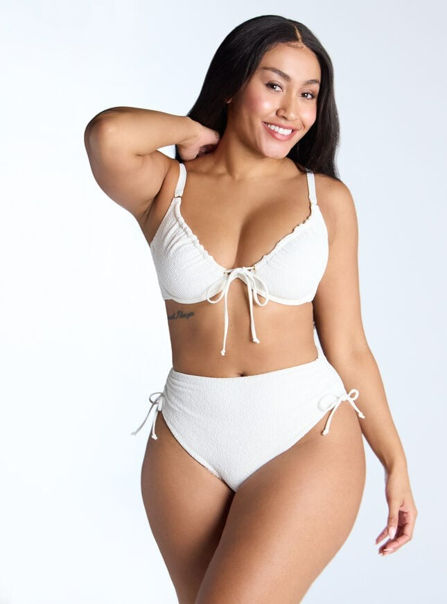 Woman in a white bikini.