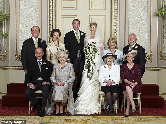Peter Phillips' father Captain Mark Phillips is pictured next to his ex-wife Princess Anne during a family portrait at their son's first wedding in 2008