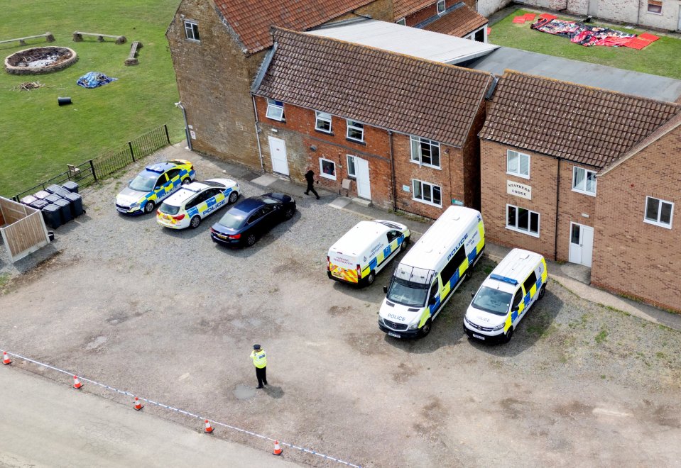 Aerial view of Stathern Lodge and police vehicles following a poisoning incident.