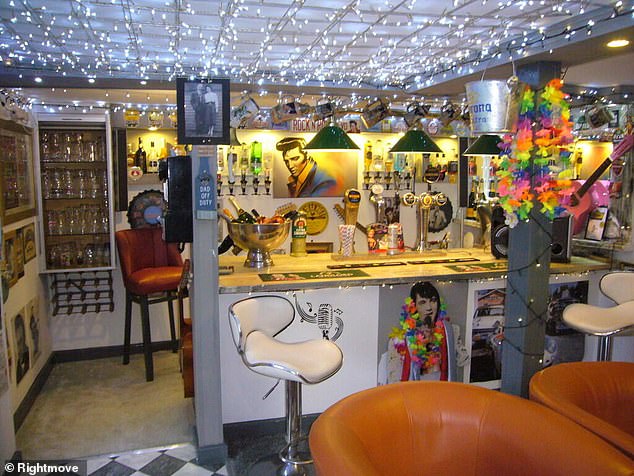 The video then goes on the show the shed-converted bar, which is also Elvis Presley themed