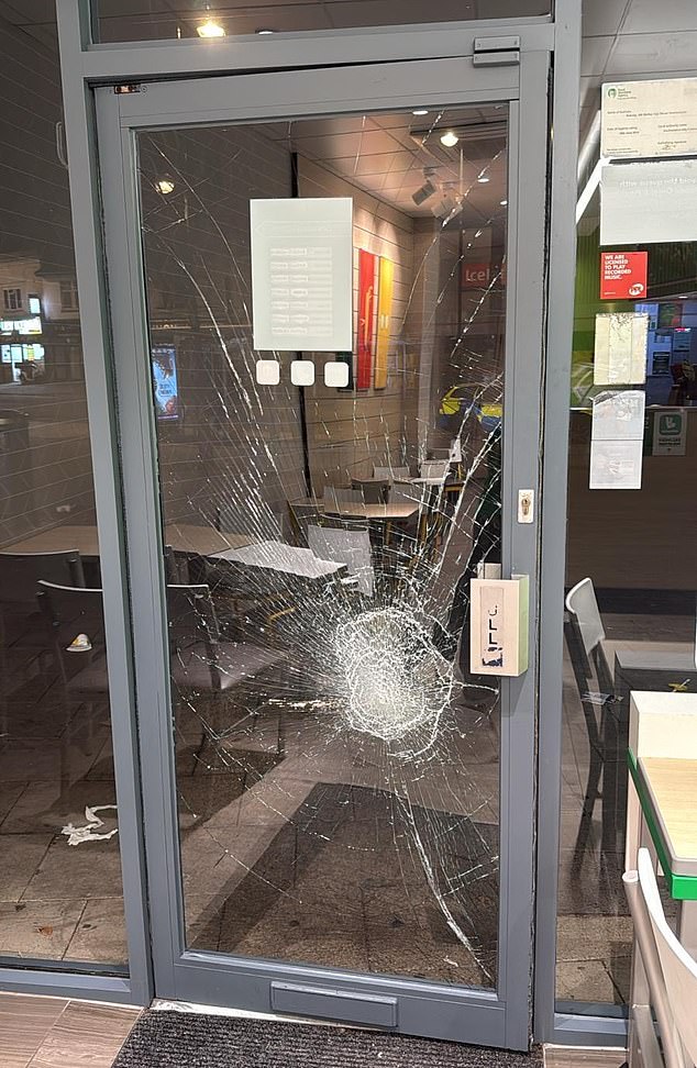 Pictured: The door of Subway was smashed by the unprovoked feral girl gang one night